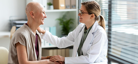 woman cancer patient talking with doctor