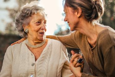 elderly woman with young woman