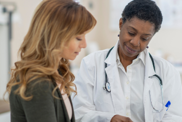 female doctor showing patient information