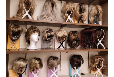 Hope Blooms Cancer Care space wall of wigs